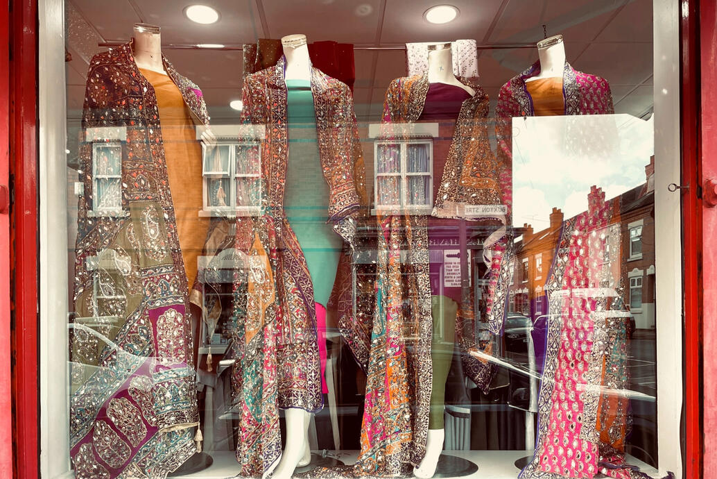 Sparkling fabric and garments in shop window
