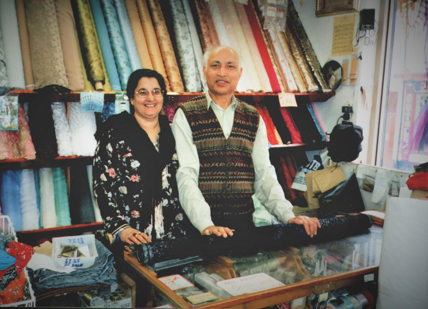 Parveen and Muhammad Shafi in their shop, the front room of their house.